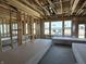 Bright living room with large windows, framed walls, and a stylish ceiling, bathed in natural light at 778 Oakleaf Dr, Greenfield, IN 46140