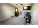 Cozy bedroom features a large closet, TV and a computer desk, offering a functional space at 8006 Sunfield Ct, Indianapolis, IN 46214