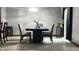 Stylish dining room with a dark dining table and seating for six at 8006 Sunfield Ct, Indianapolis, IN 46214