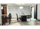 Elegant dining room with modern chandelier and a sliding glass door at 8006 Sunfield Ct, Indianapolis, IN 46214
