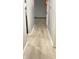 The hallway features light wood floors and a neutral wall color at 8006 Sunfield Ct, Indianapolis, IN 46214