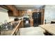 The kitchen features wood cabinets, an island, a black refrigerator, and new appliances at 8006 Sunfield Ct, Indianapolis, IN 46214