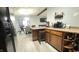 The kitchen is open to the dining room and has an island with seating at 8006 Sunfield Ct, Indianapolis, IN 46214
