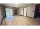 Bright living room with a stone fireplace, wood floors, and a sliding glass door at 8006 Sunfield Ct, Indianapolis, IN 46214