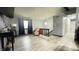 Spacious living area with light grey walls, modern flooring, and a staircase at 8006 Sunfield Ct, Indianapolis, IN 46214