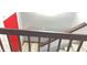 View looking down on a modern staircase with a bright red door at the top at 8006 Sunfield Ct, Indianapolis, IN 46214