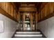 Elegant entryway showcasing detailed woodwork, marble walls, and an ornate glass door with vintage charm and character at 801 N Pennsylvania St # Apt D, Indianapolis, IN 46204