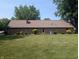Expansive backyard showcasing a well-manicured lawn and mature landscaping at 8017 Dogwood Ct, Plainfield, IN 46168