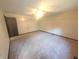 The spacious bedroom has neutral walls and carpet, and a door leads to another room at 8017 Dogwood Ct, Plainfield, IN 46168