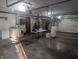 Spacious garage with laundry area, folding table, and storage at 8017 Dogwood Ct, Plainfield, IN 46168
