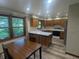 Eat-in kitchen featuring wood cabinets, white countertops, stainless steel appliances, and wood-look flooring at 8017 Dogwood Ct, Plainfield, IN 46168