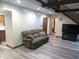 Living room featuring beamed ceiling, recessed lighting, and modern floors at 8017 Dogwood Ct, Plainfield, IN 46168