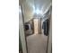 Spacious walk-in closet with clothing racks and view to bathroom with tiled floors at 8017 Dogwood Ct, Plainfield, IN 46168