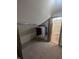 Carpeted walk-in closet with clothing rack and view to bathroom at 8017 Dogwood Ct, Plainfield, IN 46168