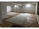 The unfinished basement includes concrete flooring with rugs and white painted walls at 8122 Tanager Ct, Indianapolis, IN 46256