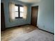 Bedroom with wood and carpeted flooring and a window at 8122 Tanager Ct, Indianapolis, IN 46256