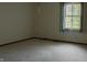 Bedroom with carpeted floors and a window that offers backyard views at 8122 Tanager Ct, Indianapolis, IN 46256