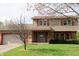 Traditional two-story home with a brick and siding exterior and well-maintained lawn at 8122 Tanager Ct, Indianapolis, IN 46256