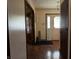 Open hallway leads to a front door with window, and a view to another room at 8122 Tanager Ct, Indianapolis, IN 46256