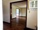 Hallway showcases hardwood floors and an opening to another room at 8122 Tanager Ct, Indianapolis, IN 46256