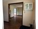 Hallway view showcases hardwood floors and leads to a bright living area at 8122 Tanager Ct, Indianapolis, IN 46256
