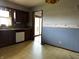 Well-lit kitchen with wood cabinets and dishwasher, leading to a bright sliding glass door at 8122 Tanager Ct, Indianapolis, IN 46256