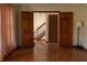 Inviting living room with hardwood floors and access to a staircase at 8122 Tanager Ct, Indianapolis, IN 46256