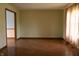 Bright living room with hardwood floors and a large window for natural light at 8122 Tanager Ct, Indianapolis, IN 46256