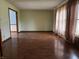Spacious living room featuring hardwood floors and large windows for ample light at 8122 Tanager Ct, Indianapolis, IN 46256