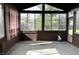 Enclosed sun room featuring many windows and a door that offers backyard views at 8122 Tanager Ct, Indianapolis, IN 46256