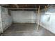 Unfinished basement room with a metal wire fence attached to the walls with wood posts at 822 N Bradley Ave, Indianapolis, IN 46201