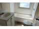 Functional bathroom with a tub and shower combo, toilet, and a sink with vanity showcasing all essential amenities at 822 N Bradley Ave, Indianapolis, IN 46201