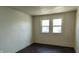 A bedroom featuring white walls, wood floors, and a window bringing in natural light at 822 N Bradley Ave, Indianapolis, IN 46201