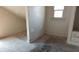 Attic bedroom with natural light from a window, carpeted floors and a closet for storage at 822 N Bradley Ave, Indianapolis, IN 46201