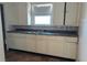 Functional kitchen with abundant cabinetry and a stainless steel sink and laminate countertops provides ample workspace at 822 N Bradley Ave, Indianapolis, IN 46201