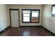 Bright living room featuring hardwood floors, a door and windows, offering a cozy space for relaxation and gatherings at 822 N Bradley Ave, Indianapolis, IN 46201