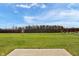 Expansive backyard with a well-maintained lawn and a sturdy wooden fence, providing privacy and space at 8442 Averly Park Dr, Indianapolis, IN 46237