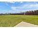 Spacious, grassy backyard fully enclosed with a wood fence for privacy and security at 8442 Averly Park Dr, Indianapolis, IN 46237