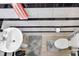 A full bathroom with a modern sink and a sleek, striped black and white tile accent wall at 8442 Averly Park Dr, Indianapolis, IN 46237