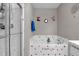 Bathroom with a tub, glass enclosed shower and decorated with decorative wall art and accessories at 8442 Averly Park Dr, Indianapolis, IN 46237