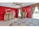Bedroom with two windows, ornate dresser, bedside lamps, and decorative wall at 8442 Averly Park Dr, Indianapolis, IN 46237