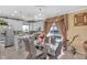 Chandelier illuminates a dining area, conveniently situated near the kitchen and the backyard at 8442 Averly Park Dr, Indianapolis, IN 46237