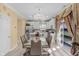 Bright dining area with a glass table, chandelier, and sliding door to backyard at 8442 Averly Park Dr, Indianapolis, IN 46237