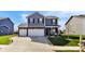 Charming two-story home featuring a well-manicured lawn, neutral siding, and a two-car garage, embodying modern suburban living at 8442 Averly Park Dr, Indianapolis, IN 46237
