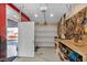 Spacious garage with abundant storage, including a workbench and pegboard, enhancing organization at 8442 Averly Park Dr, Indianapolis, IN 46237