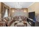 Cozy living room with elegant furnishings, sophisticated lighting, and a mounted TV for a stylish and comfortable living space at 8442 Averly Park Dr, Indianapolis, IN 46237