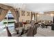 Open-concept living spaces with a dining area, chandeliers, and elegant decorations at 8442 Averly Park Dr, Indianapolis, IN 46237