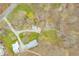 A bird's-eye view of the property, nearby road, surrounded by lush trees at 8503 Bean Blossom Rd, Trafalgar, IN 46181