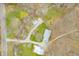 Aerial view of property, a road, and a peaceful creek flowing by at 8503 Bean Blossom Rd, Trafalgar, IN 46181