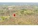 Overhead perspective showcasing the property's location amidst a lush, wooded area, highlighted by a red marker at 8503 Bean Blossom Rd, Trafalgar, IN 46181
